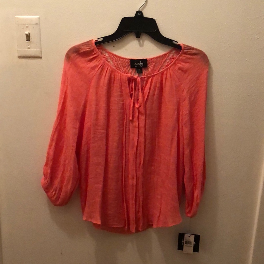 Pretty see through top in orange.